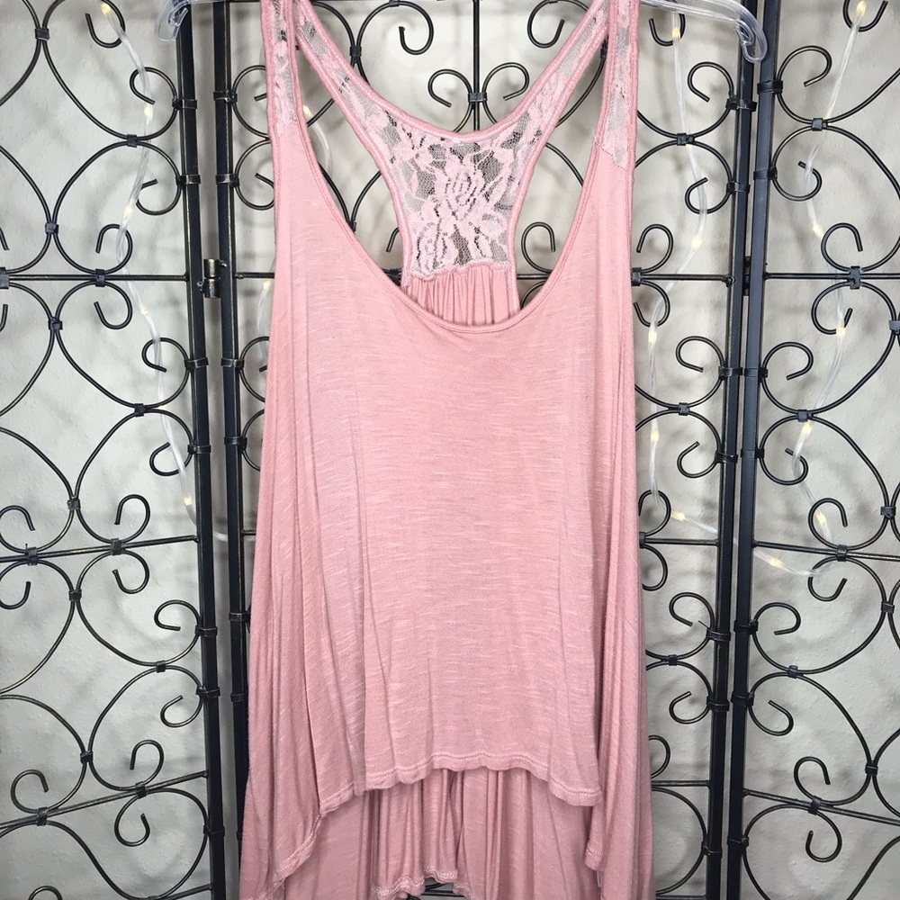 Blush colored, flowy tank top with lace detailing